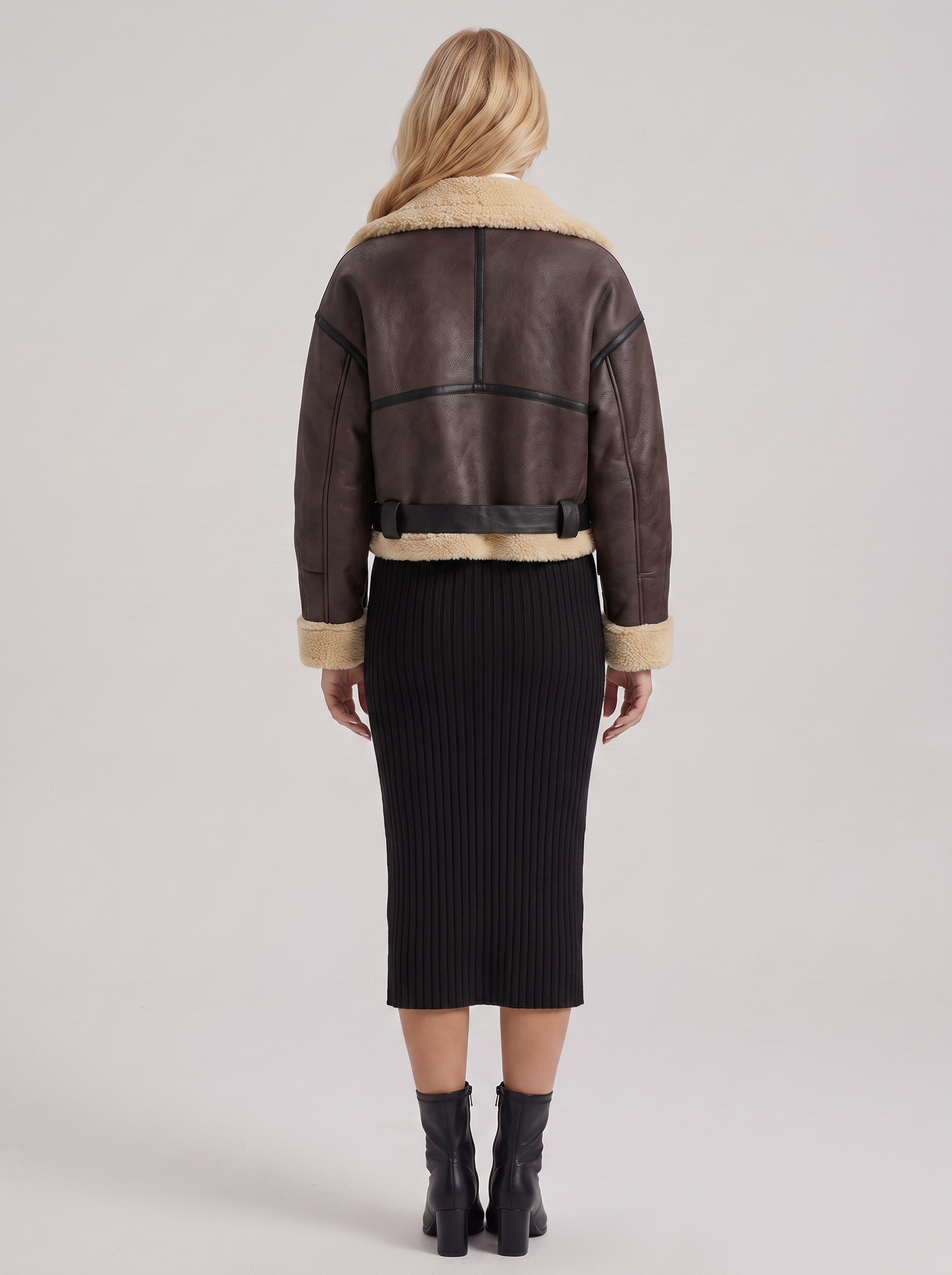 Women brown cropped faux leather aviator jacket with faux shearling collar and belt, back view
