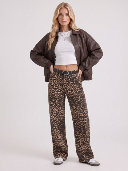 Women brown oversized faux leather bomber jacket with point collar and snap placket, three quarter view