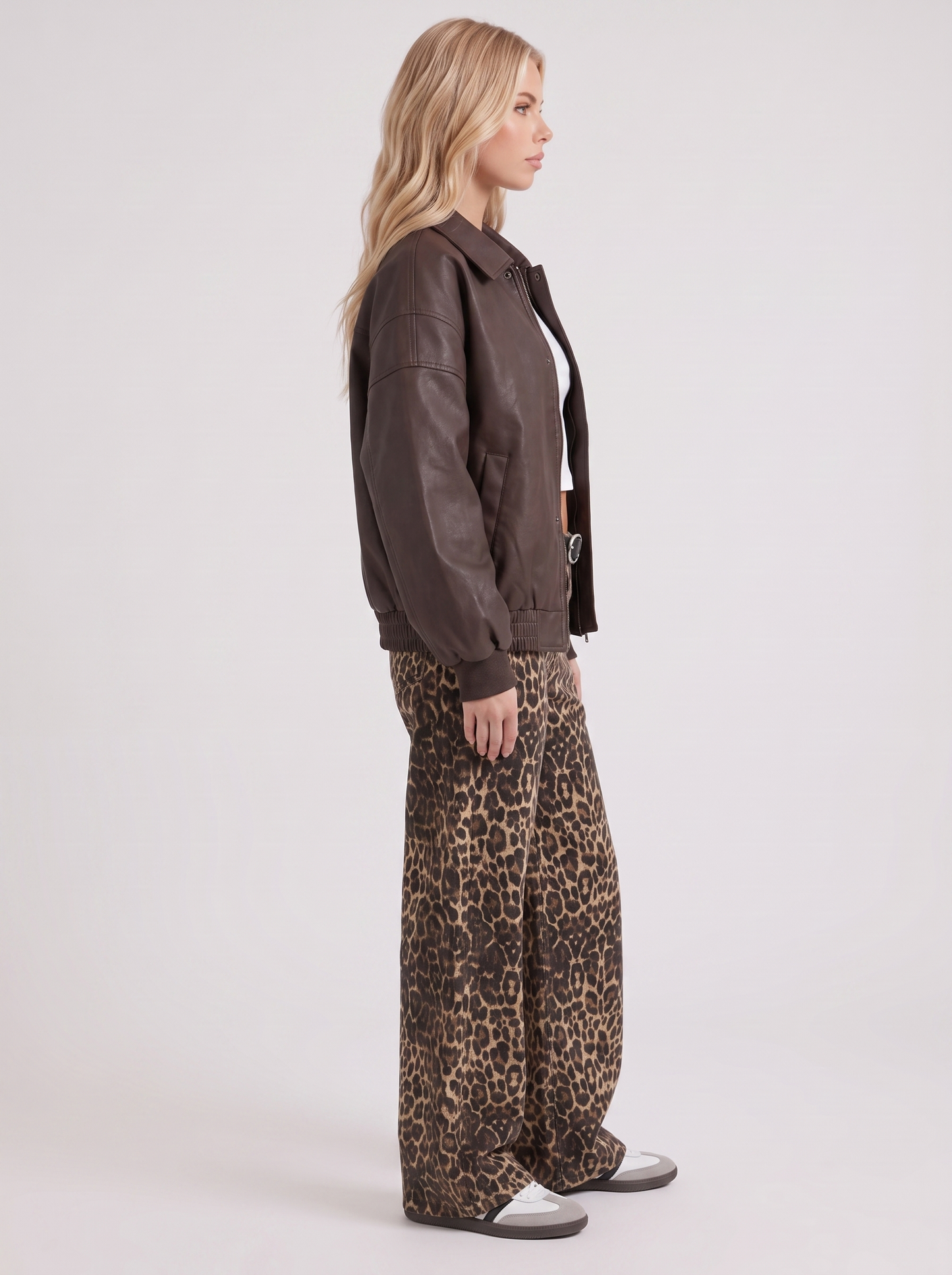 Women brown oversized faux leather bomber jacket with point collar and snap placket, side view