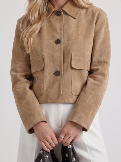 Women camel cropped faux suede jacket with point collar and two flap pockets, fabric closeup
