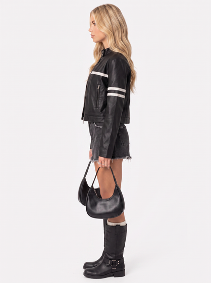 Women black cropped faux leather racer jacket with contrast chest and sleeve stripes, side view