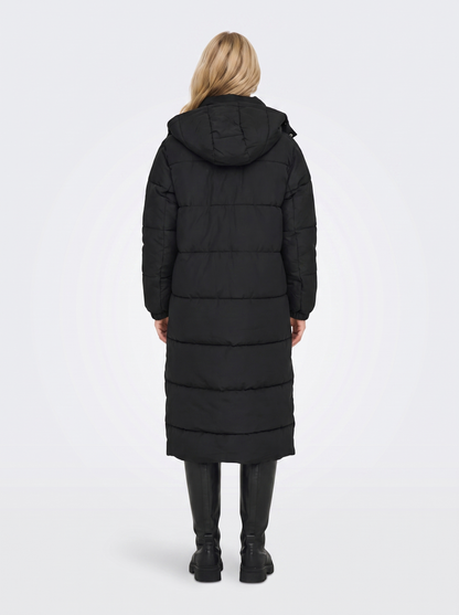 Women black longline hooded puffer coat with horizontal quilting and zip front, back view