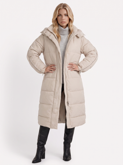 Women brown longline hooded puffer coat with horizontal quilting and zip front, three quarter view