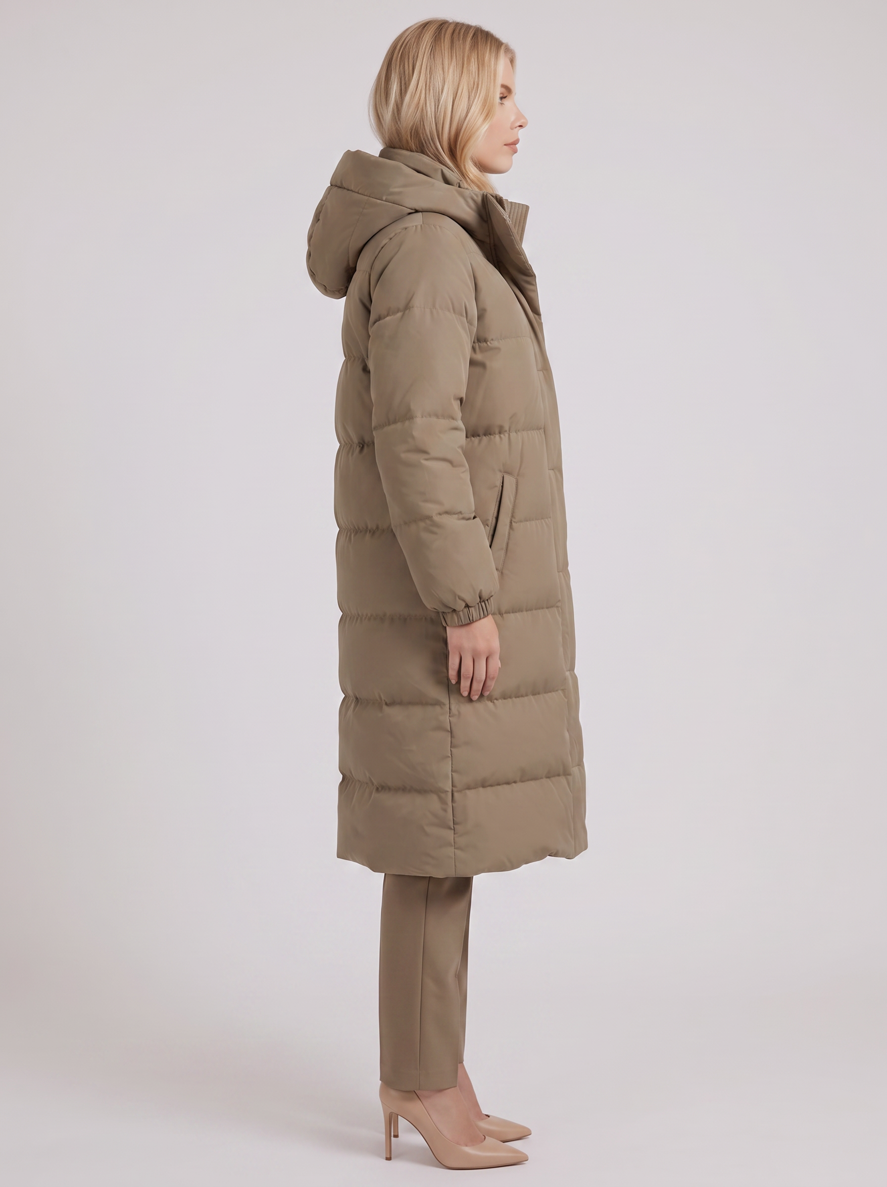 Women white longline hooded puffer coat with horizontal quilting and zip front, side view