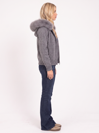 Women gray hooded rib knit cardigan with faux fur pompom ties and open front, side view