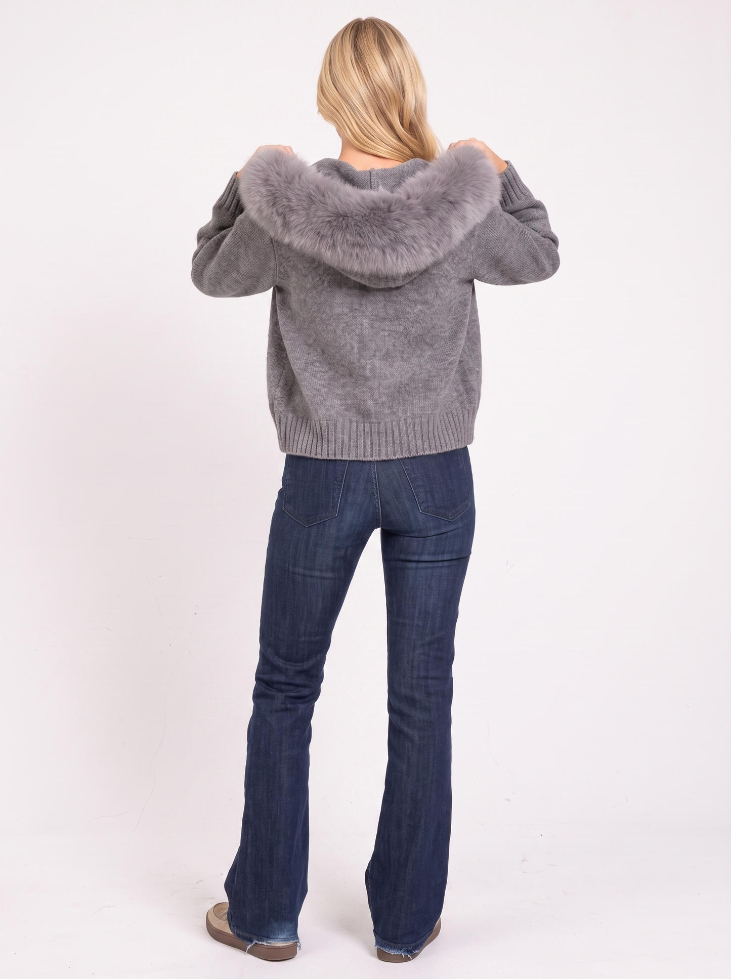 Women gray hooded rib knit cardigan with faux fur pompom ties and open front, back view