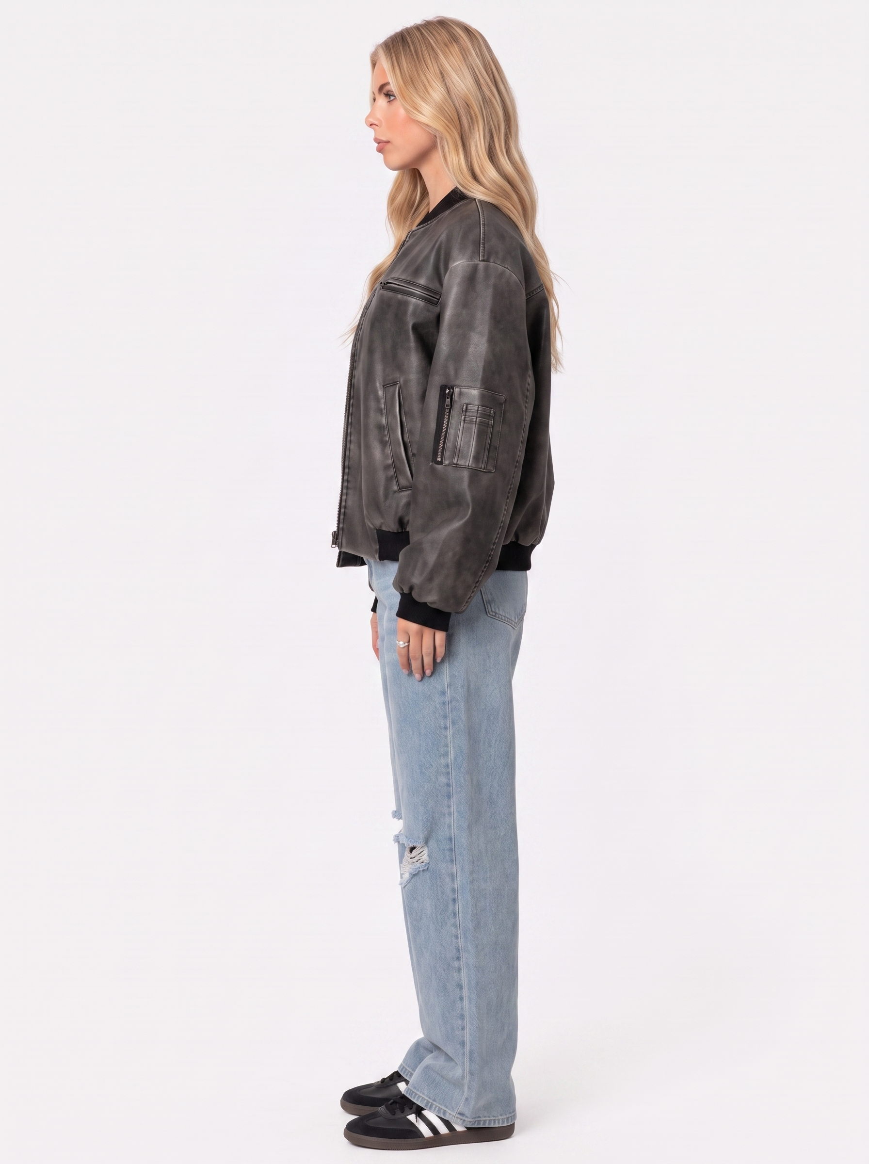 Women gray oversized washed faux leather bomber jacket with zip and utility pockets, side view