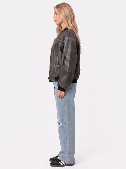 Women gray oversized washed faux leather bomber jacket with zip and utility pockets, side view
