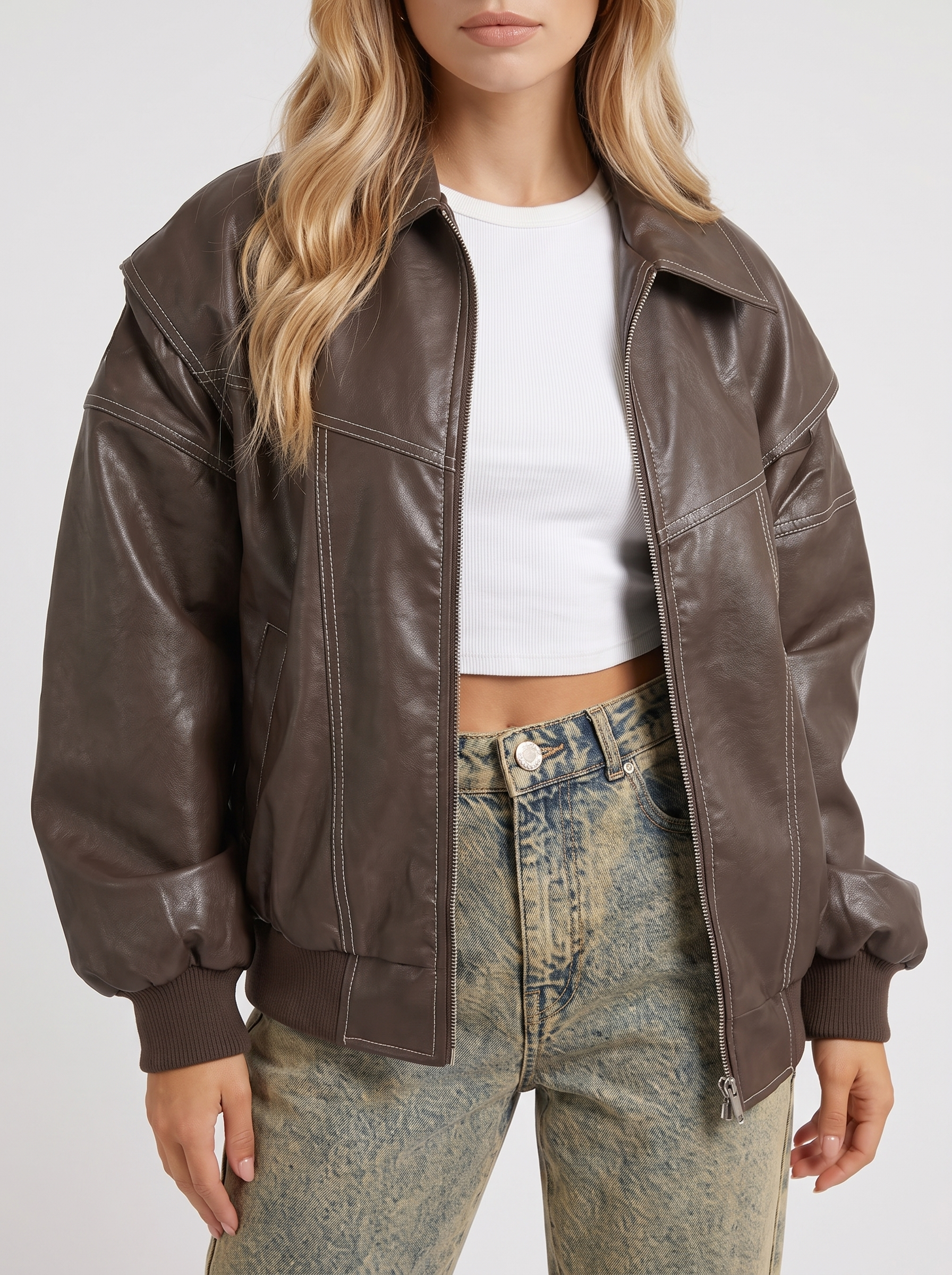 Women brown oversized distressed faux leather bomber jacket with contrast topstitching, fabric closeup