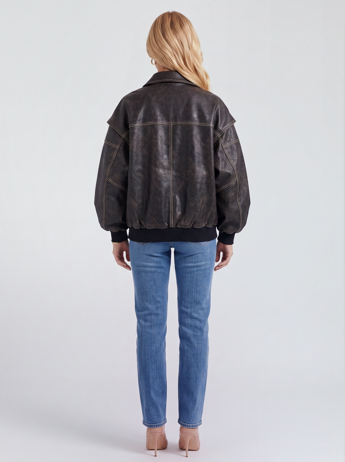 Women black oversized leather look bomber jacket shown from the back