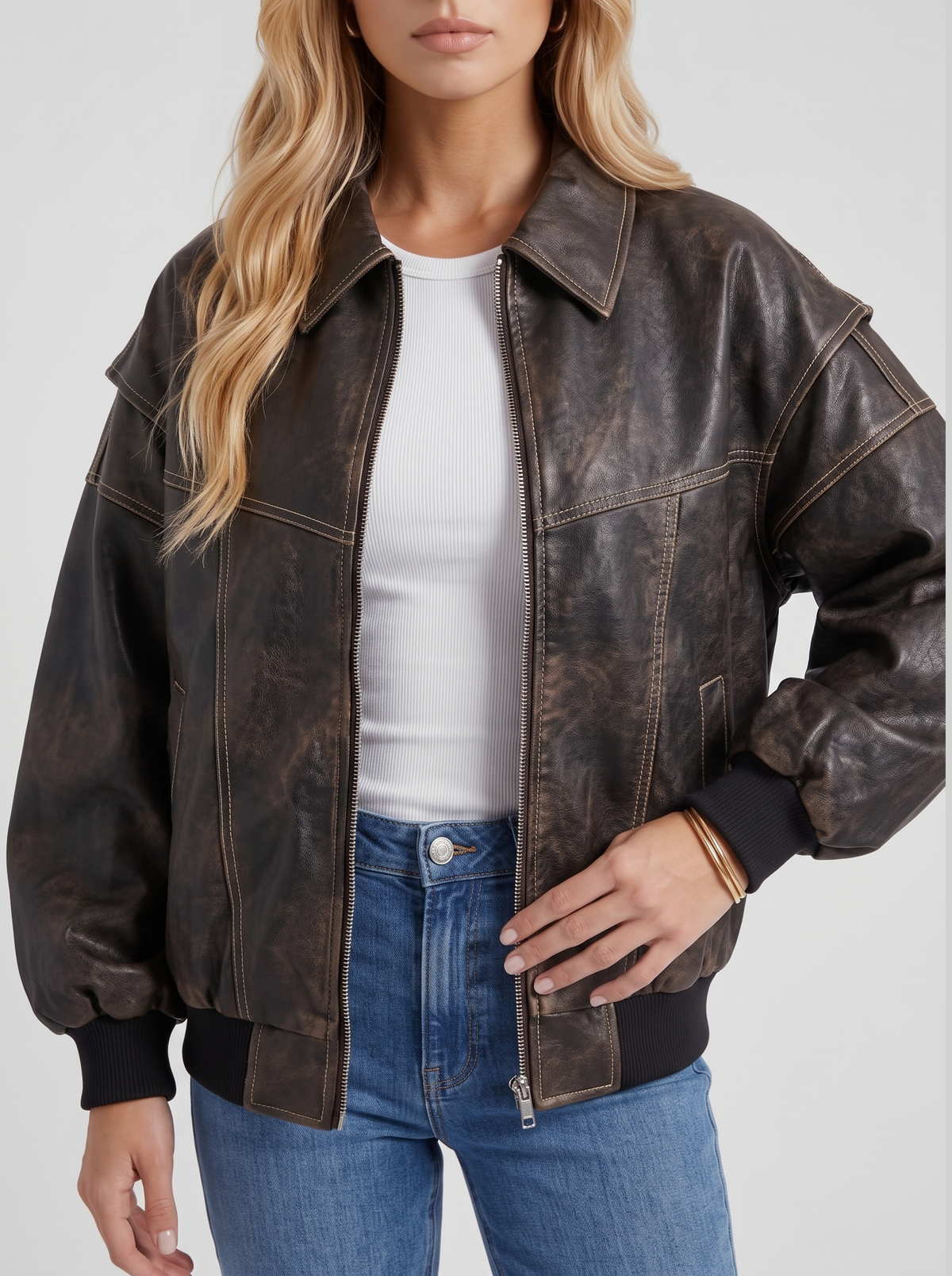 Women black oversized leather look bomber jacket, close view of the leather look finish