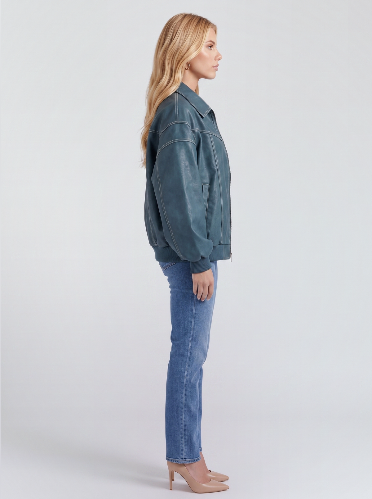 Women green oversized leather look bomber jacket shown from the side