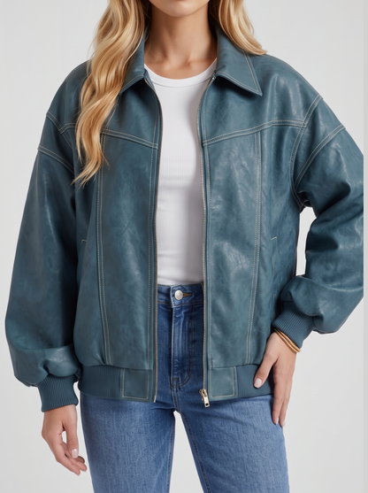 Women green oversized leather look bomber jacket, close view of the leather look finish