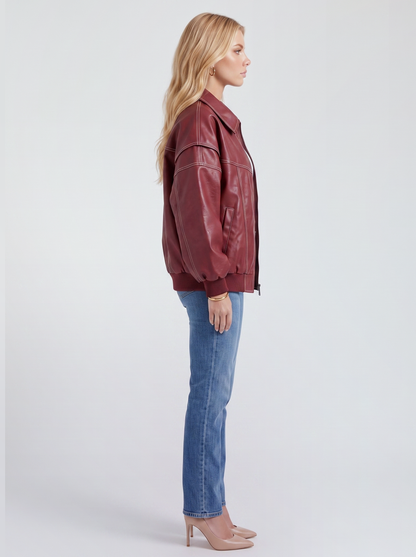Women red oversized leather look bomber jacket shown from the side