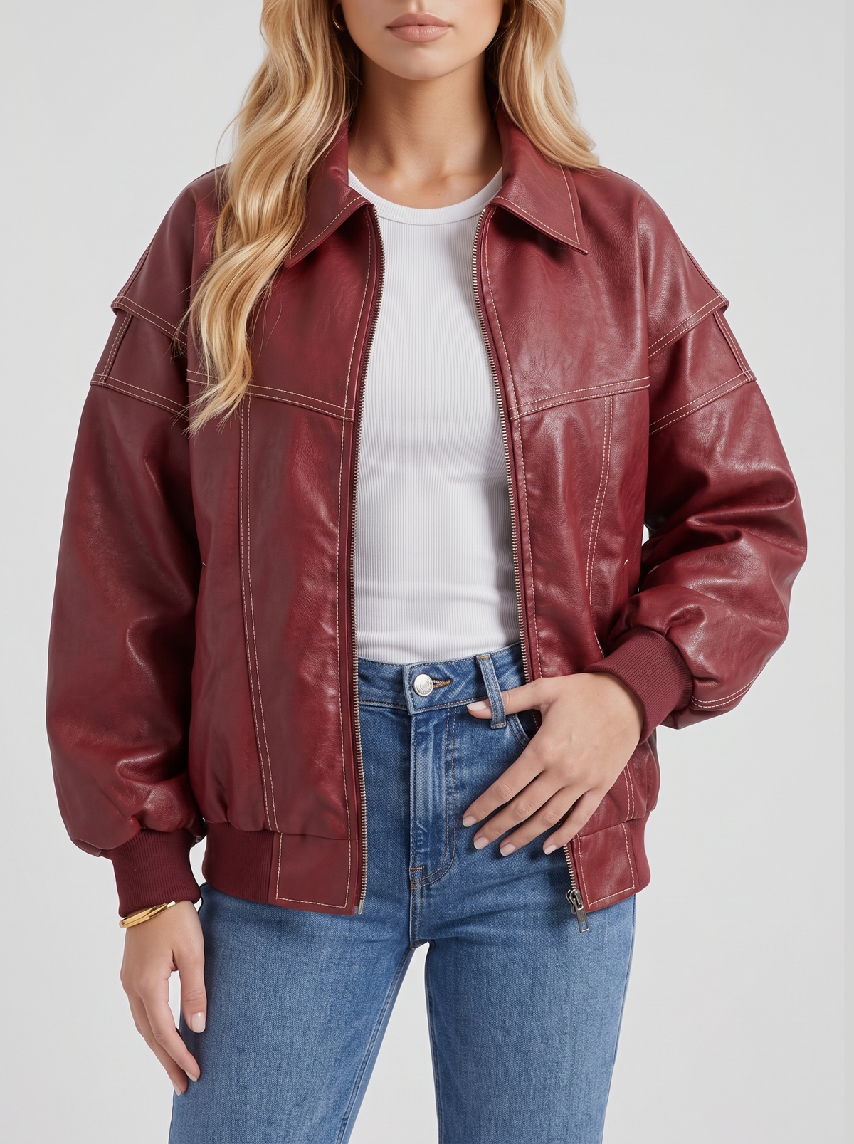 Women red oversized leather look bomber jacket, close view of the leather look finish