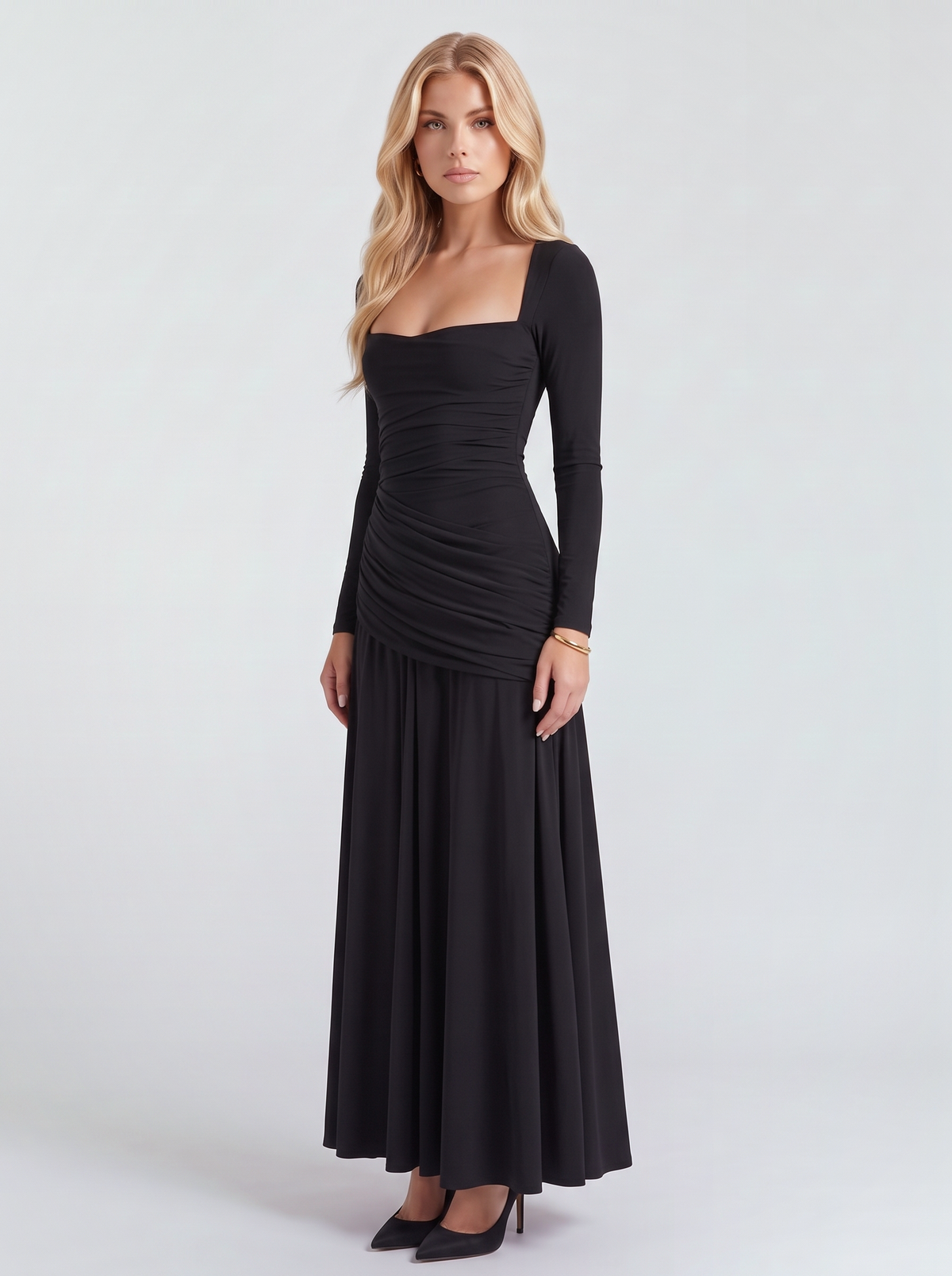 Women black long sleeve ruched maxi dress with a draped hip and a flowing skirt, three quarter view