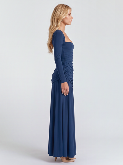 Women navy long sleeve ruched maxi dress with a fitted bodice and a flowing skirt, side view