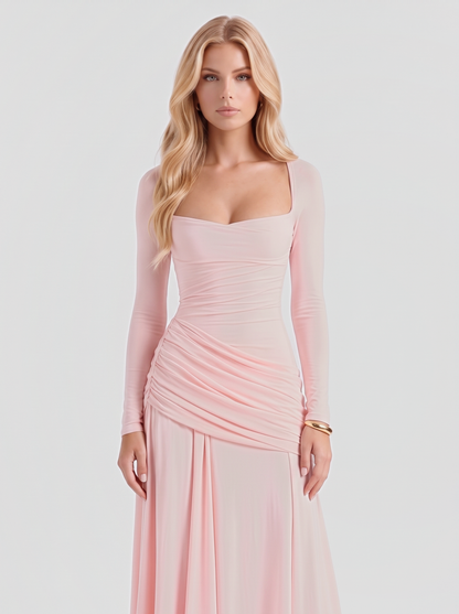 Women pink long sleeve ruched maxi dress with a square neckline, knees up view