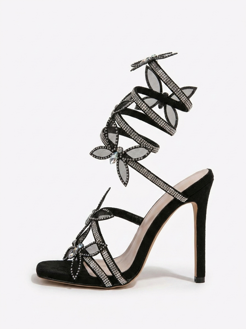 Women black heeled sandals with wrap straps and butterfly detail