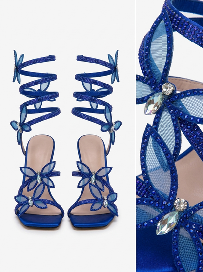 Women blue heeled sandals with wrap straps and butterfly detail