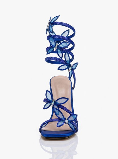 Women blue heeled sandals with wrap straps and butterfly detail