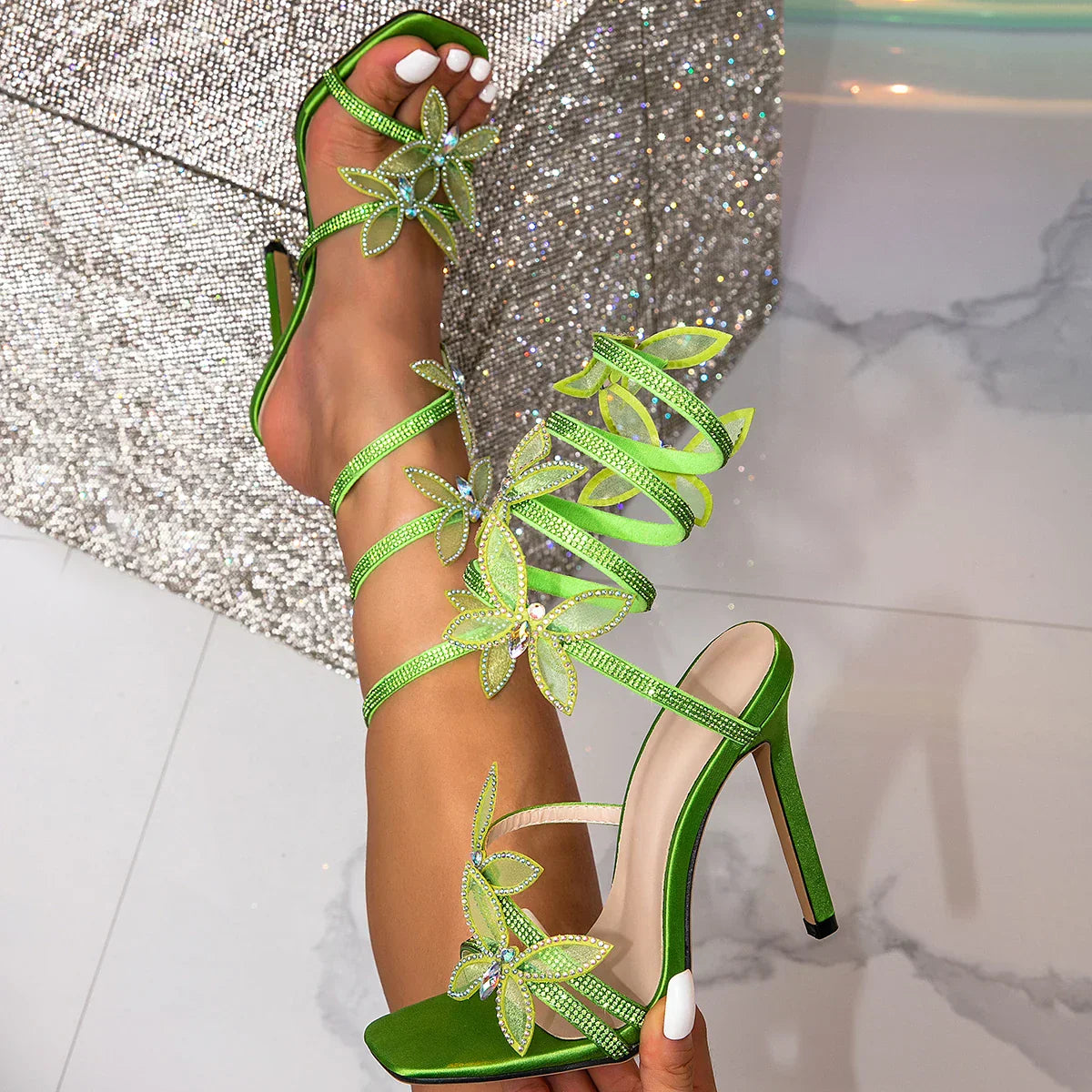 Women green heeled sandals with wrap straps and butterfly detail