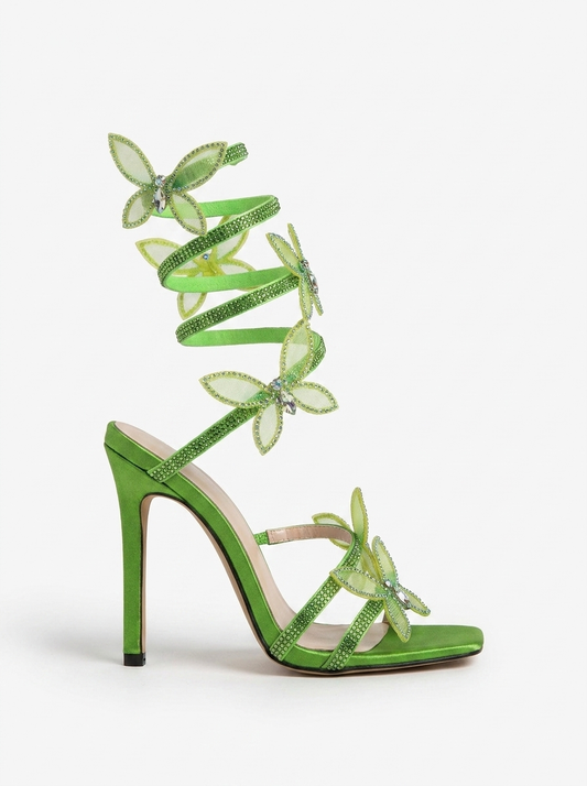 Women green heeled sandals with wrap straps and butterfly detail
