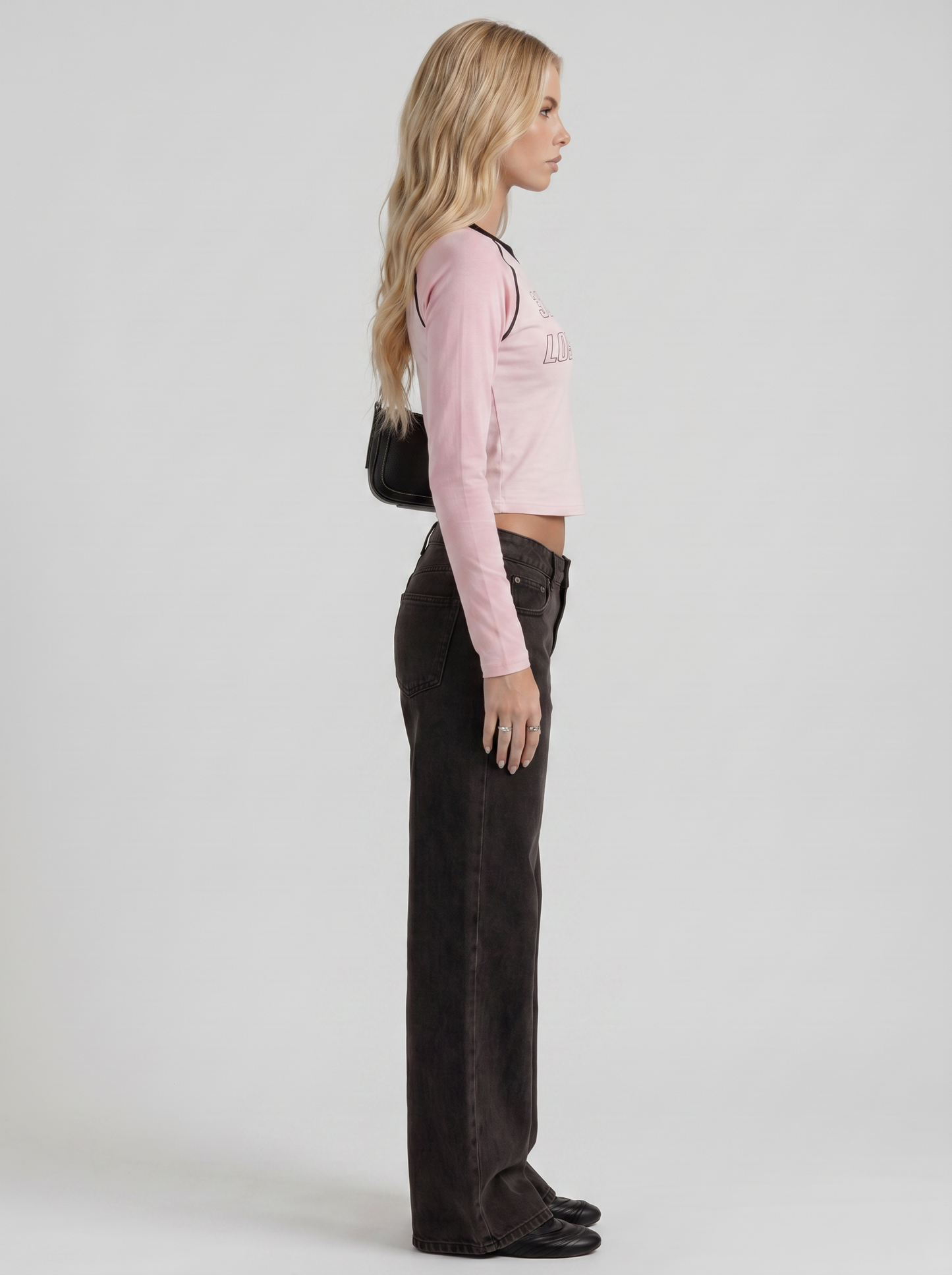 Women black wide leg bow detail jeans, side profile view