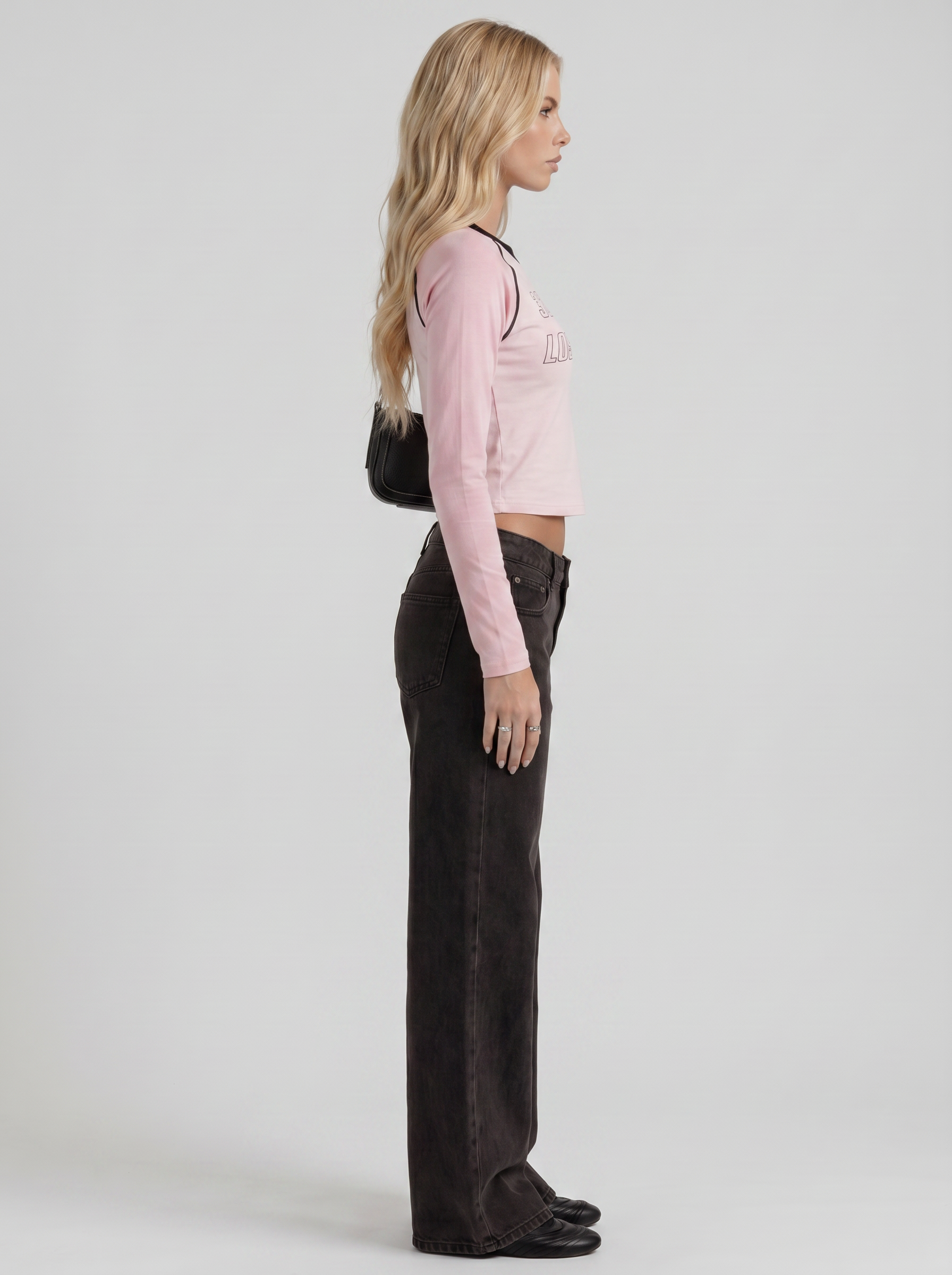Women black wide leg bow detail jeans, side profile view