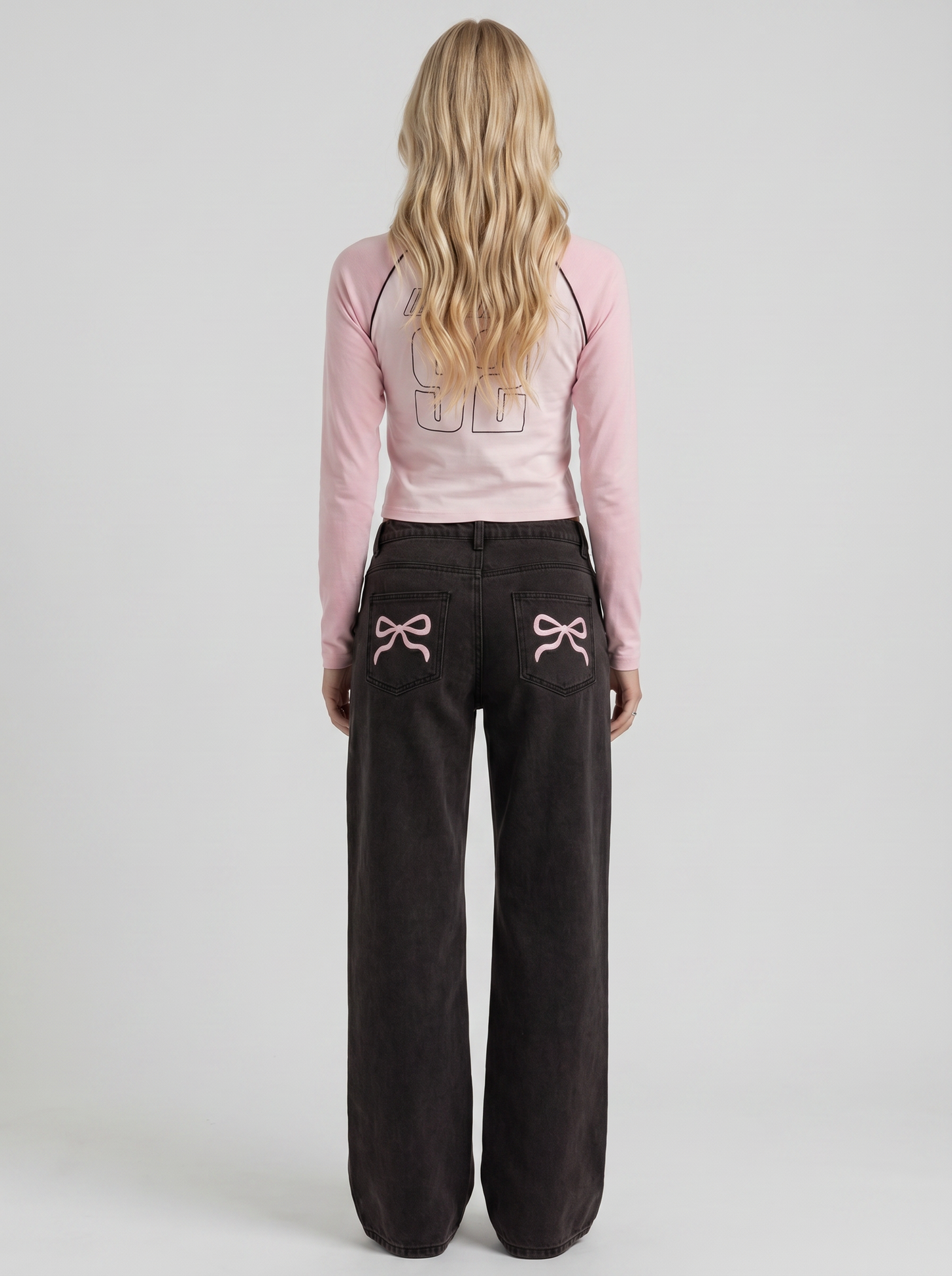 Women black wide leg bow detail jeans, back view