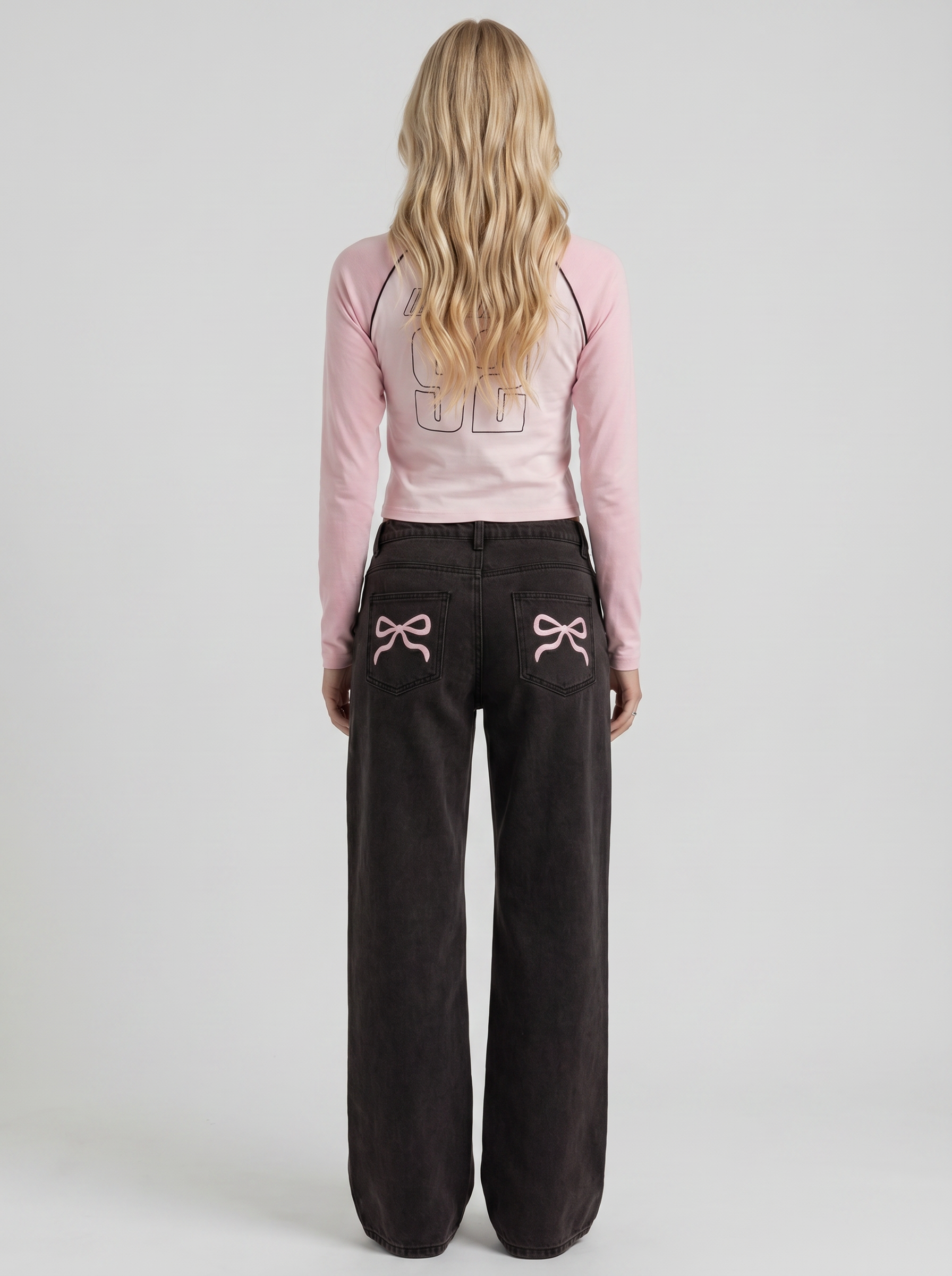 Women black wide leg bow detail jeans, back view