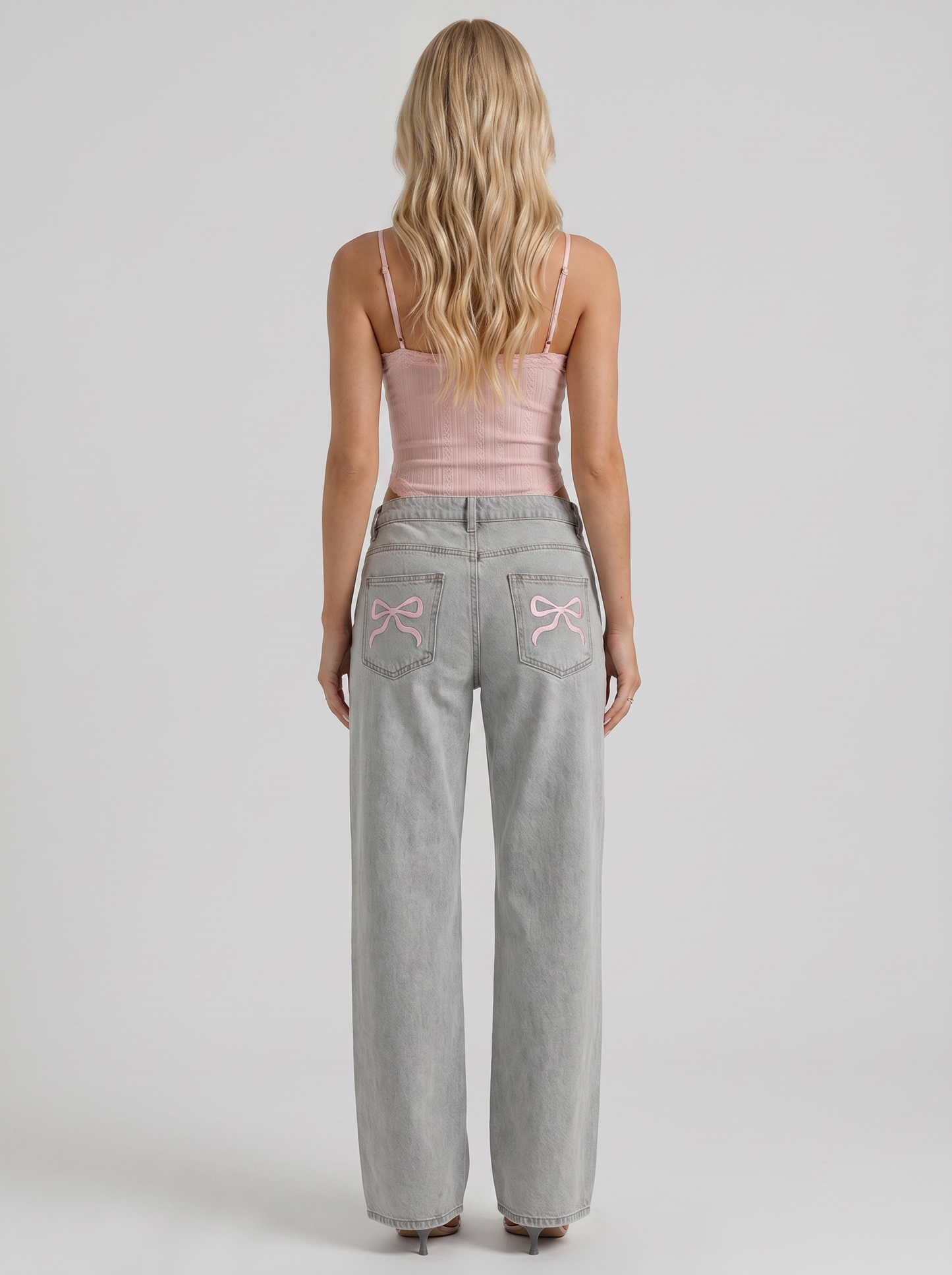 Women blue wide leg bow detail jeans, back view