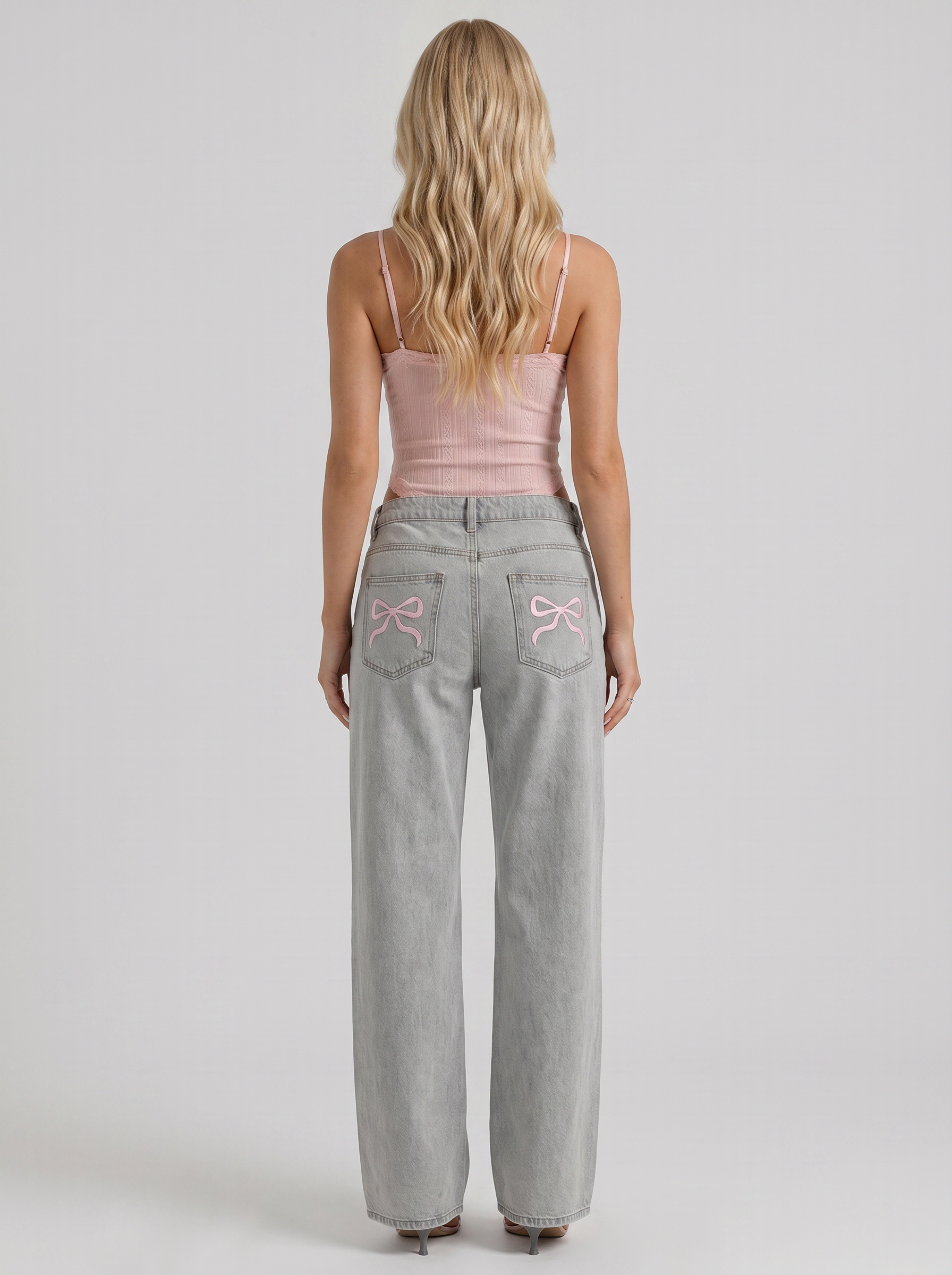 Women blue wide leg bow detail jeans, back view