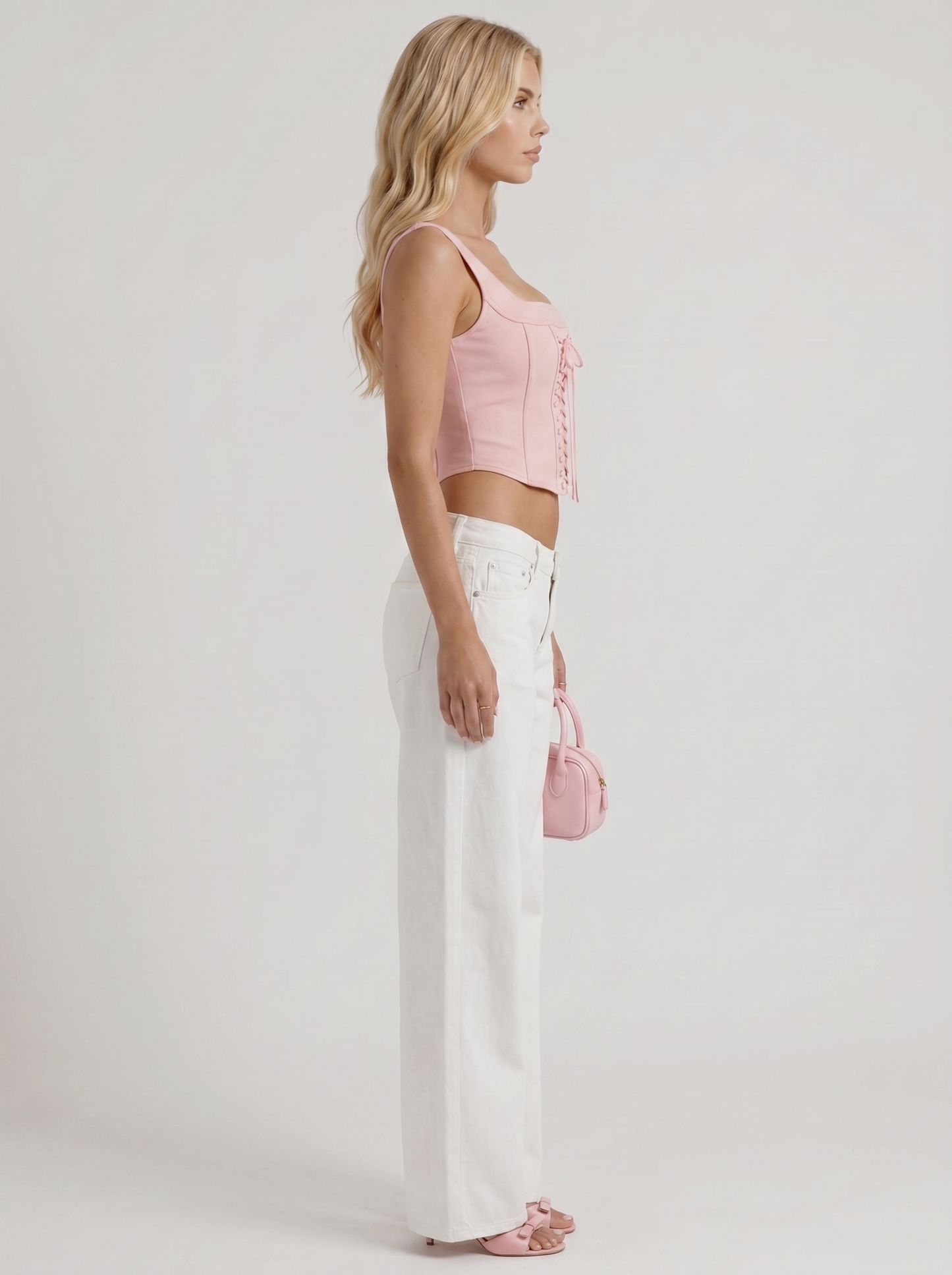 Women white wide leg bow detail jeans, side profile view
