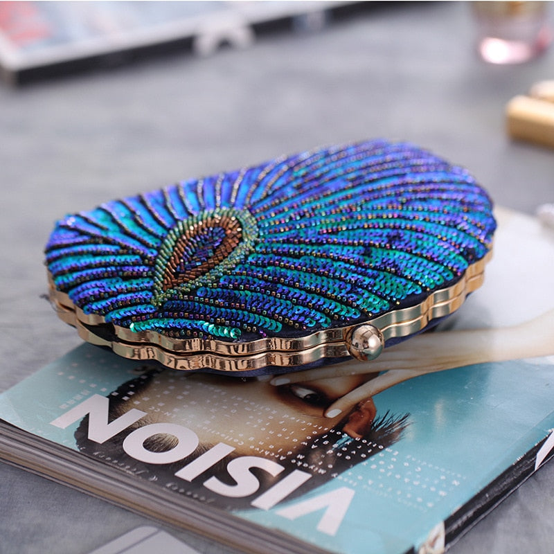 Women blue clutch bag with sequin finish and beaded detail
