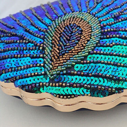 Women blue clutch bag with sequin finish and beaded detail