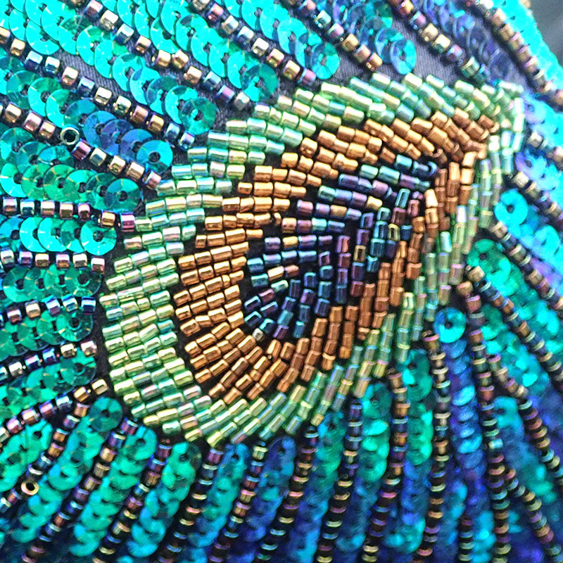 Women blue clutch bag with sequin finish and beaded detail