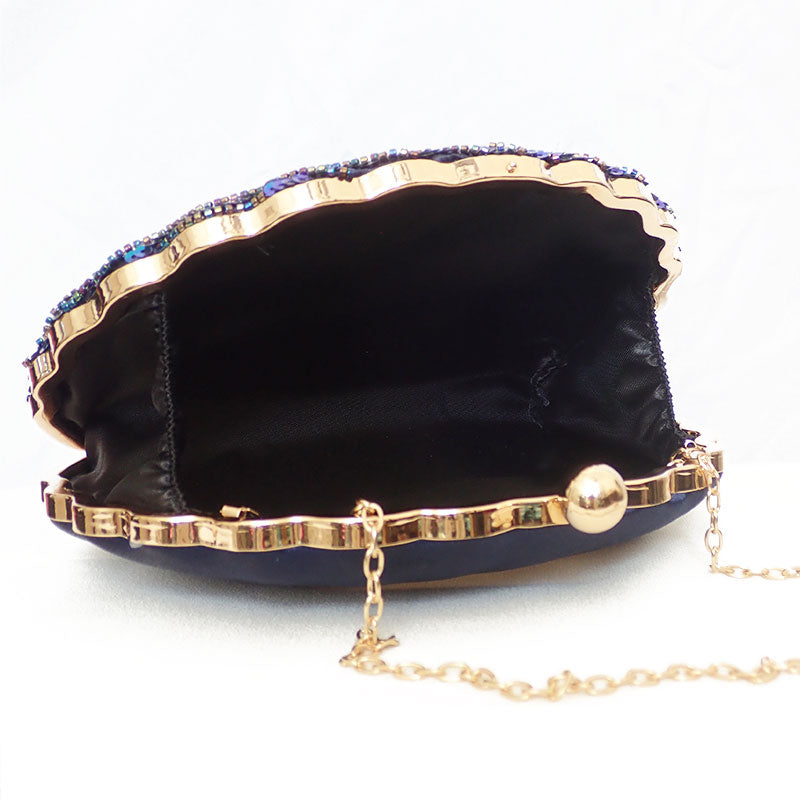Women blue clutch bag with sequin finish and beaded detail