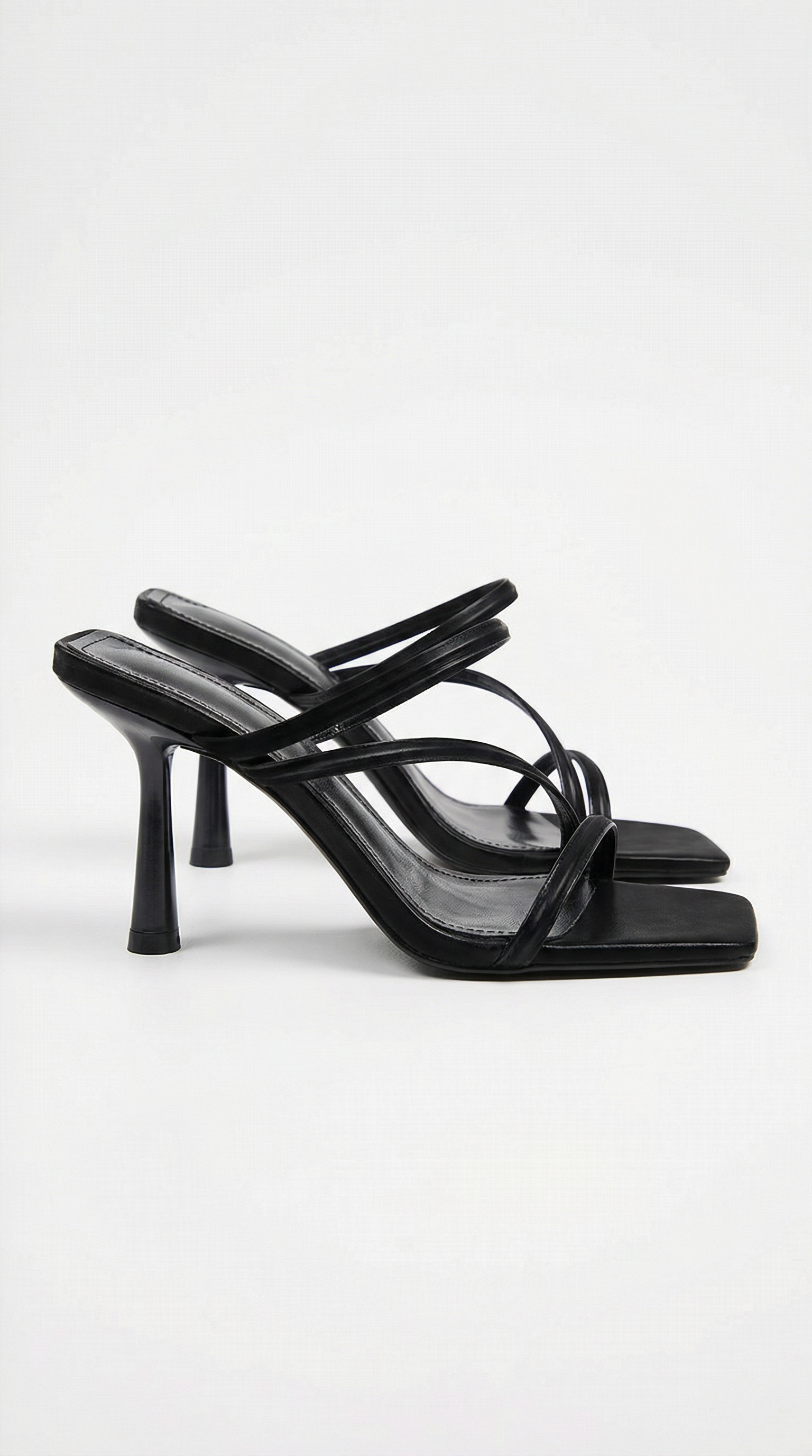 Women black heeled sandals with square toe and cross straps