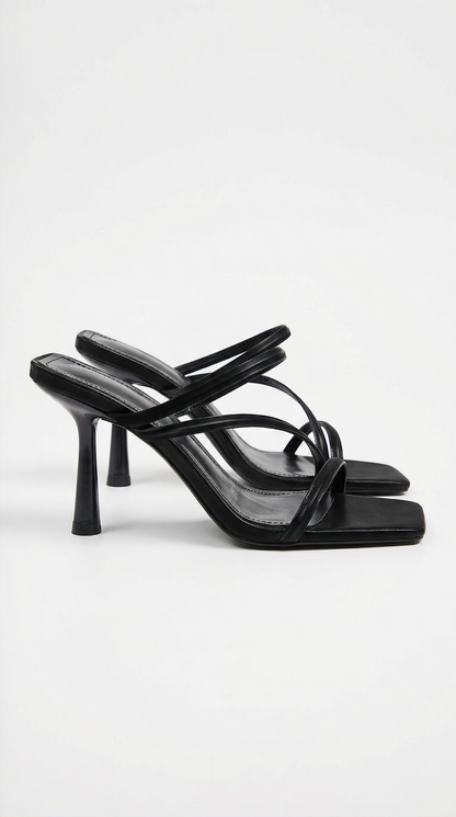 Women black heeled sandals with square toe and cross straps