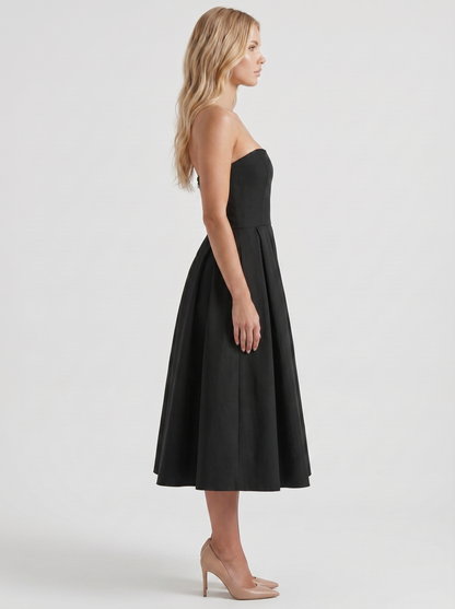 Women black strapless pleated midi dress with fitted bodice, side profile