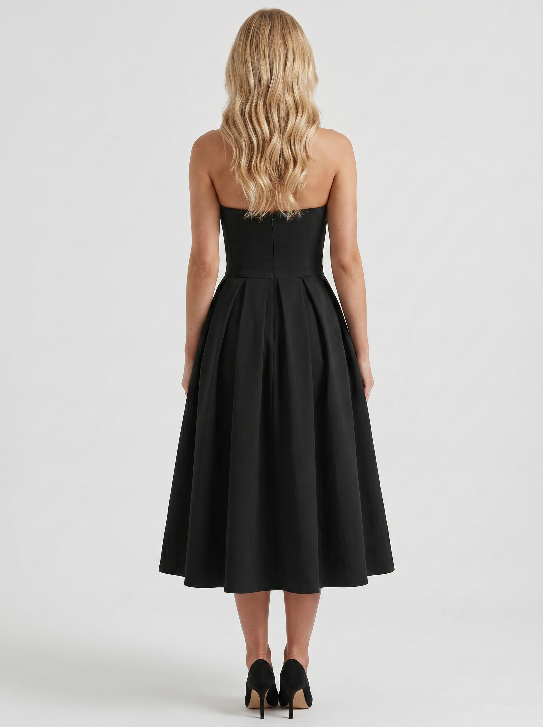 Women black strapless pleated midi dress with open back, back view
