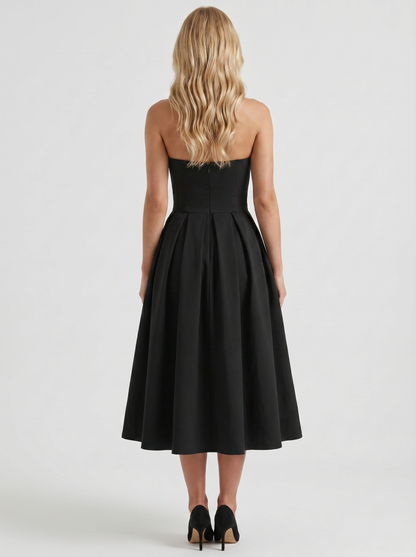 Women black strapless pleated midi dress with open back, back view