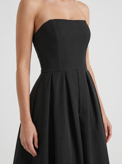 Women black strapless pleated midi dress closeup of bodice and pleat detail