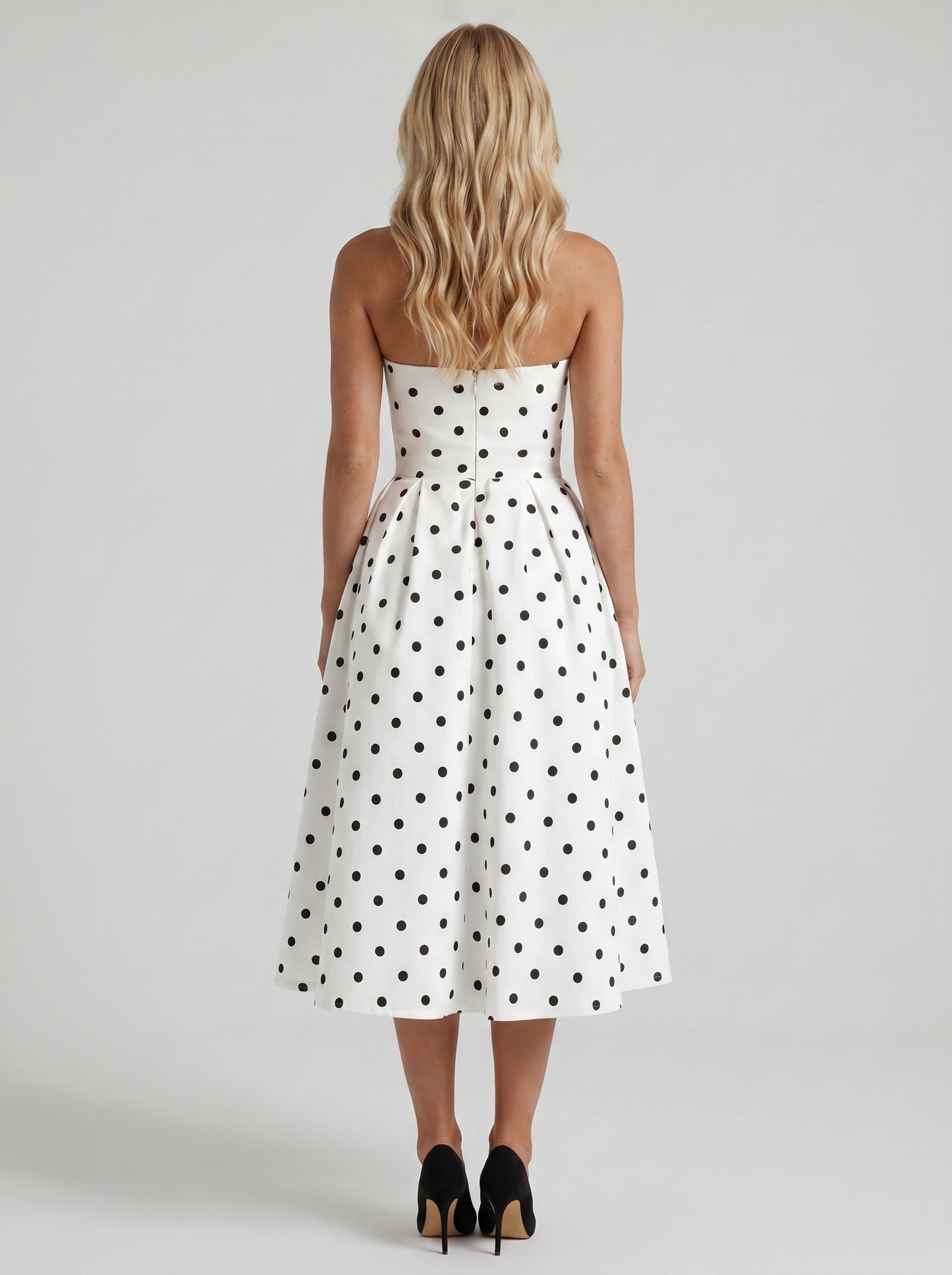 Women black polka dot strapless pleated midi dress with open back, back view