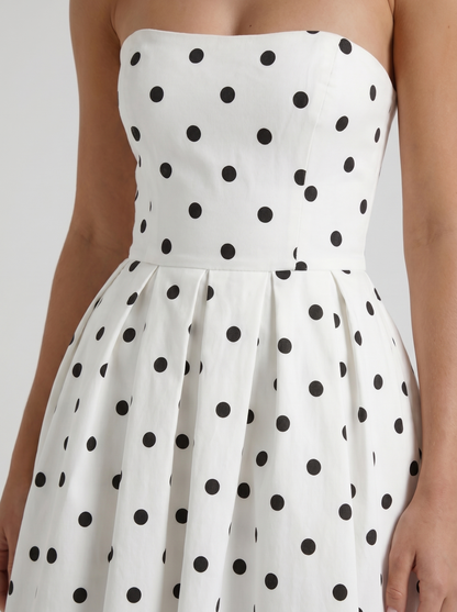 Women black polka dot strapless pleated midi dress closeup of bodice and pleat detail