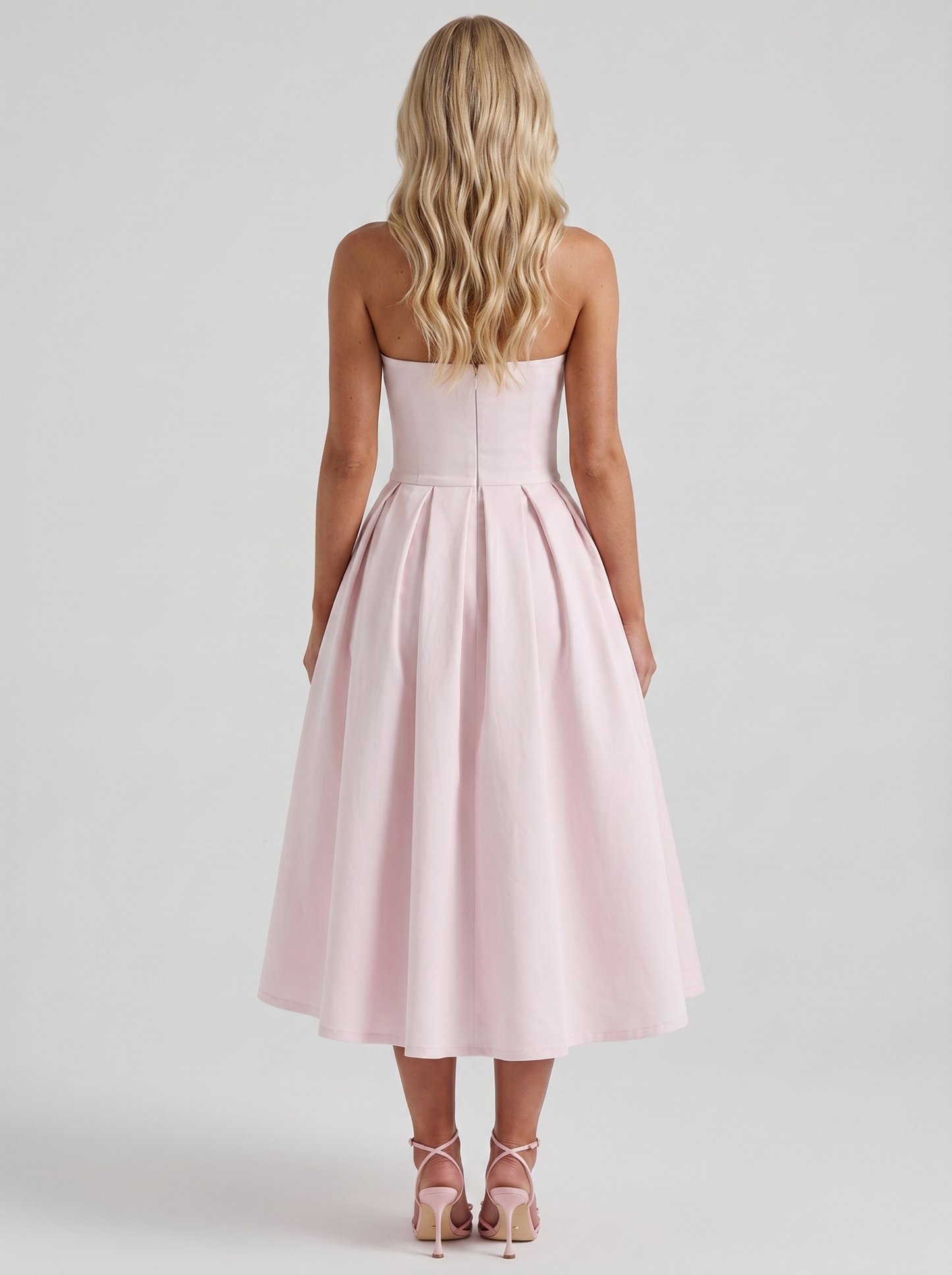 Women blush strapless pleated midi dress with open back, back view