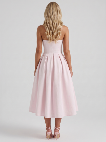 Women blush strapless pleated midi dress with open back, back view