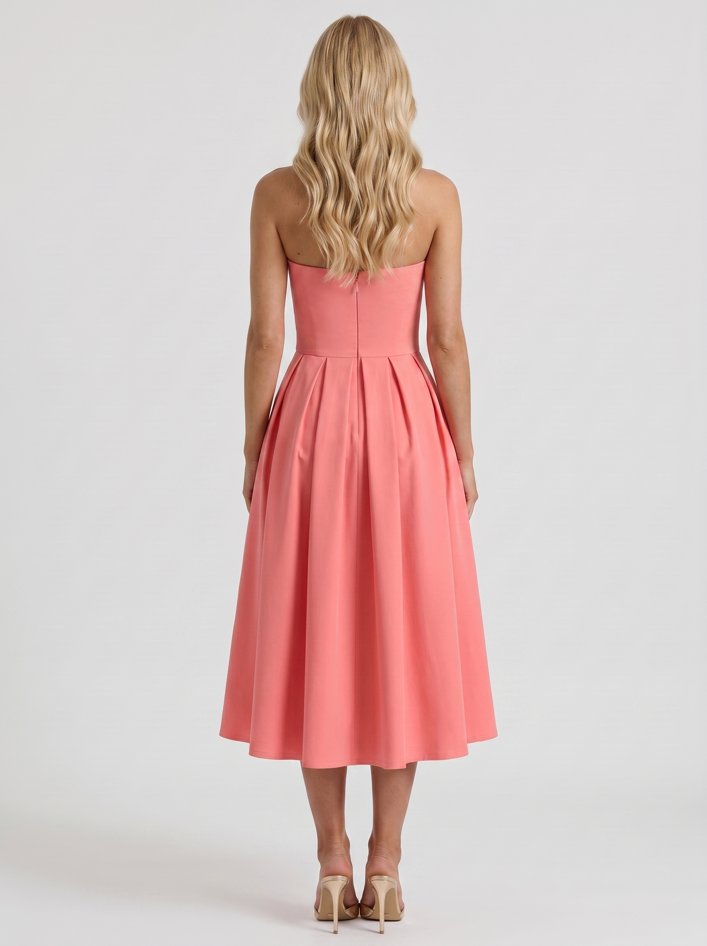 Women coral pink strapless pleated midi dress with open back, back view