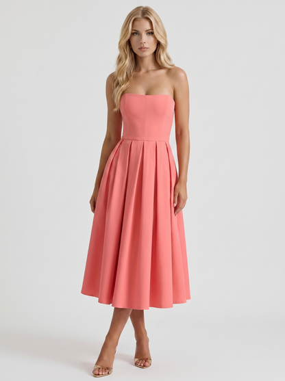 Women coral pink strapless pleated A line midi dress with fitted bodice, front view